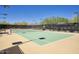 Well maintained tennis court with desert landscaping in background at 18515 N 97Th Way, Scottsdale, AZ 85255