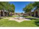 Beautiful water fountain with a paved walkway and views of surrounding mountains and community amenities at 18515 N 97Th Way, Scottsdale, AZ 85255