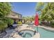 Spacious backyard featuring a pool, hot tub, patio and outdoor lounge area at 18581 E Aubrey Glen Rd, Queen Creek, AZ 85142