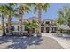 Elegant two-story home with desert landscaping and mature palm trees enhances curb appeal at 18581 E Aubrey Glen Rd, Queen Creek, AZ 85142