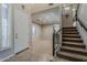 Spacious entryway with staircase and access to multiple living areas at 18581 E Aubrey Glen Rd, Queen Creek, AZ 85142