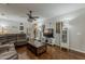 Inviting living room with hardwood floors, ceiling fan, and casual decor at 18581 E Aubrey Glen Rd, Queen Creek, AZ 85142