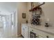 Elegant wet bar area with wine rack, glassware, and ample counter space at 18581 E Aubrey Glen Rd, Queen Creek, AZ 85142
