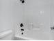 Clean white bathroom features a tiled shower and tub combo with black fixtures at 19172 E Kingbird Dr, Queen Creek, AZ 85142