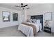 Bedroom features a modern ceiling fan and two windows allowing plenty of natural light to fill the space at 19172 E Kingbird Dr, Queen Creek, AZ 85142