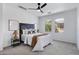 Bright bedroom with a large bed, stylish headboard, and plenty of natural light from the windows at 19172 E Kingbird Dr, Queen Creek, AZ 85142