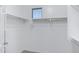 Walk-in closet with shelving and a small window for natural light at 19172 E Kingbird Dr, Queen Creek, AZ 85142