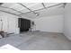 Spacious garage with epoxy floors and plenty of storage cabinets at 19172 E Kingbird Dr, Queen Creek, AZ 85142