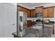 Kitchen features stainless steel appliances, dark countertops, and tiled flooring at 19172 E Kingbird Dr, Queen Creek, AZ 85142