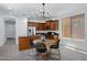 Eat-in kitchen features stainless steel appliances, dark countertops, and modern light fixture at 19172 E Kingbird Dr, Queen Creek, AZ 85142