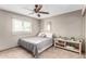 Neutral bedroom with a queen bed, ceiling fan and closet at 2001 W Surrey Ave, Phoenix, AZ 85029