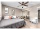 Bedroom with a queen bed, ceiling fan, closet, and decor at 2001 W Surrey Ave, Phoenix, AZ 85029