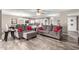 Spacious living room flowing into the kitchen and dining area with contemporary decor at 2001 W Surrey Ave, Phoenix, AZ 85029