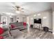 Bright living room with a decorative ceiling fan and neutral toned walls and decor at 2001 W Surrey Ave, Phoenix, AZ 85029