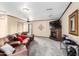 Spacious living room with a comfortable sofa, fireplace and entertainment center at 2001 W Surrey Ave, Phoenix, AZ 85029