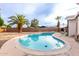 Backyard pool with palm trees and clear blue water, great for relaxing and enjoying the Arizona sunshine at 2001 W Surrey Ave, Phoenix, AZ 85029