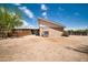 Back view of a home with a large backyard and fencing at 2024 N 200Th Ave, Buckeye, AZ 85396