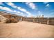 Backyard featuring a fence and blooming plant at 2024 N 200Th Ave, Buckeye, AZ 85396