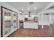 Kitchen with stainless appliances, butcher block island, and access to the outdoor patio with double doors at 2024 N 200Th Ave, Buckeye, AZ 85396