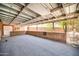 A large, covered patio space with brick accents and ample room for outdoor activities at 2024 N 200Th Ave, Buckeye, AZ 85396