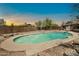 Backyard pool offers relaxation and fun with desert landscaping and privacy fencing at 2024 N 200Th Ave, Buckeye, AZ 85396