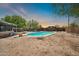 Backyard pool with diving board and desert landscaping at 2024 N 200Th Ave, Buckeye, AZ 85396