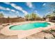 Backyard featuring an in-ground pool and wooden fence at 2024 N 200Th Ave, Buckeye, AZ 85396