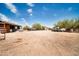 Spacious property with trucks, buildings, offering ample parking and storage capabilities at 2024 N 200Th Ave, Buckeye, AZ 85396