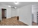 Empty bonus room with neutral walls, vinyl floors, closet, air conditioner and view to a hallway at 2024 N 200Th Ave, Buckeye, AZ 85396