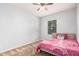 Cozy bedroom with neutral paint, ceiling fan, carpeted floor, and a twin-sized bed at 20261 W Desert Bloom St, Buckeye, AZ 85326