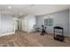 Upstairs bonus room with carpeting and various exercise machines at 20261 W Desert Bloom St, Buckeye, AZ 85326