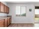 Bright kitchen with wood cabinets, plenty of counter space and access to the backyard at 20261 W Desert Bloom St, Buckeye, AZ 85326