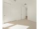 Clean bedroom with closet and open door at 20368 N 224Th Dr, Surprise, AZ 85387
