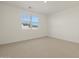 Carpeted bedroom with neutral walls and a window providing natural light at 20368 N 224Th Dr, Surprise, AZ 85387