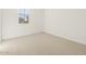 Neutral-toned bedroom with a bright window at 20368 N 224Th Dr, Surprise, AZ 85387