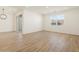Bright living area featuring wood-look tile flooring, recessed lighting, and sliding glass door to backyard at 20368 N 224Th Dr, Surprise, AZ 85387