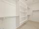 Walk-in closet with built-in shelving and clothing rods at 20368 N 224Th Dr, Surprise, AZ 85387