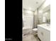 Clean bathroom with a shower-tub combo and a vanity with storage at 21690 N Lynn St, Maricopa, AZ 85138