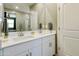 Well-lit bathroom with double sinks, a large mirror, and modern fixtures at 21690 N Lynn St, Maricopa, AZ 85138
