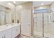 Modern bathroom features double sinks, a walk-in shower, and ample counter space at 21690 N Lynn St, Maricopa, AZ 85138
