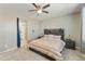 Cozy bedroom with a wood accent wall and a neutral color palette at 21690 N Lynn St, Maricopa, AZ 85138