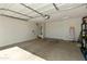 Spacious two car garage with overhead lighting and ample storage space at 21690 N Lynn St, Maricopa, AZ 85138