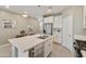 Kitchen featuring a large island, stainless steel appliances, and white cabinets with modern countertops at 21690 N Lynn St, Maricopa, AZ 85138