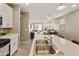 Bright kitchen showcasing a center island with a sink, modern pendant lighting, and an open layout at 21690 N Lynn St, Maricopa, AZ 85138