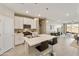 Open-concept kitchen featuring an island with bar seating, stainless steel appliances, and modern cabinetry at 21690 N Lynn St, Maricopa, AZ 85138