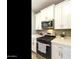 Well-equipped kitchen with stainless steel appliances, gas range, and ample cabinet space at 21690 N Lynn St, Maricopa, AZ 85138
