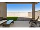Relaxing outdoor patio featuring comfortable seating and views of the backyard at 21690 N Lynn St, Maricopa, AZ 85138