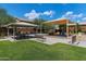 Community playground with a covered picnic area and lots of play equipment at 21690 N Lynn St, Maricopa, AZ 85138