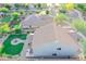 The home features a manicured lawn, stone patio with outdoor kitchen, and a lovely fountain feature at 2211 W Desert Ln, Phoenix, AZ 85041