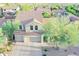 This aerial view displays the home's exterior, terracotta roof, desert landscaping, and wide driveway at 2211 W Desert Ln, Phoenix, AZ 85041